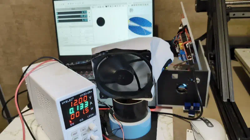 The set up with a fan directing air over the drivers with a paper duct
